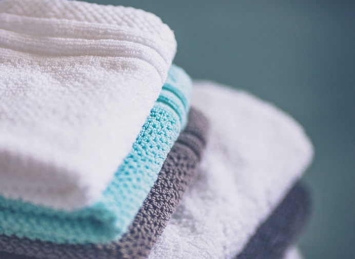 Stack of freshly laundered towels and washcloths