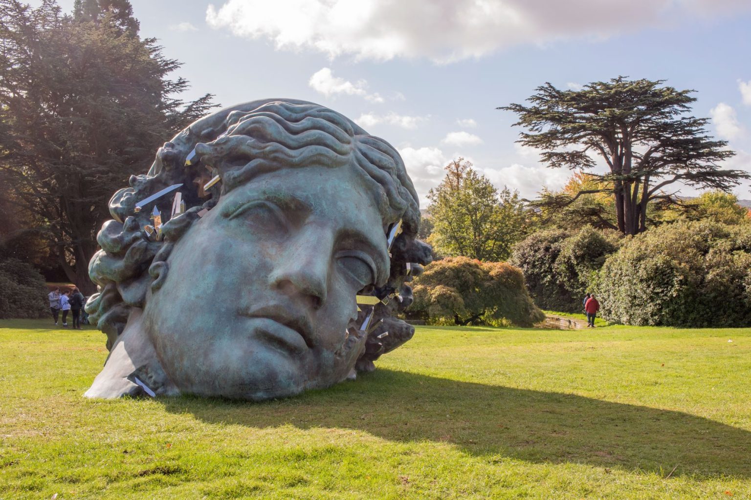 Panoramic view of impressive sculptures amidst the lush green park at Yorkshire