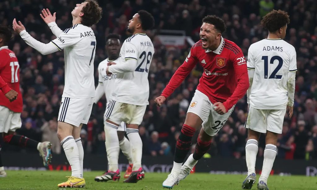 A player from Leeds United and Man United contesting the ball