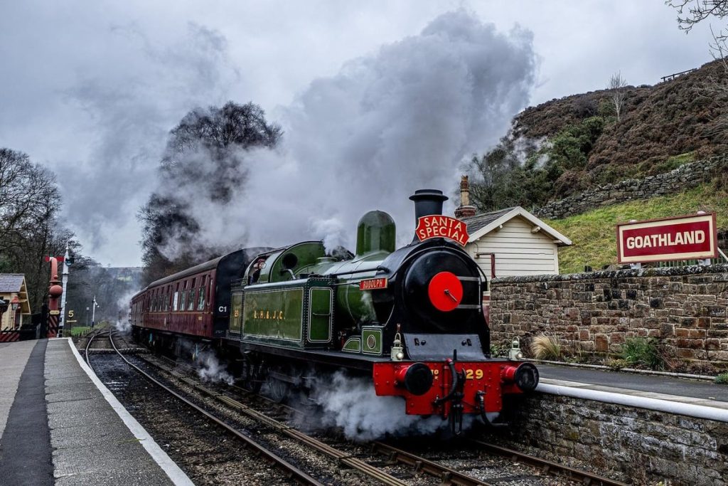 A vintage steam train journeying through the scenic North Yorkshire Moors