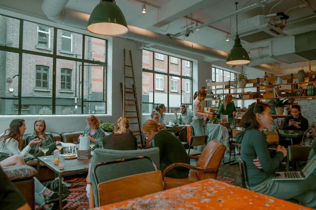 Cozy interior of one of the best hidden restaurants in London that locals swear by, featuring warm lighting, rustic wooden tables, and an intimate dining atmosphere